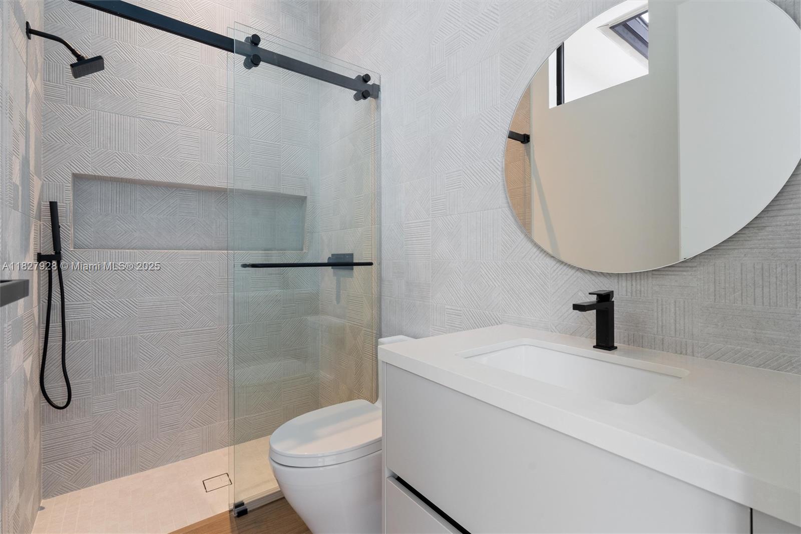 1520 Southwest 149th Terrace Fort Lauderdale, FL 33325 - Photo 44 of 80 a bathroom with a sink a toilet and a mirror