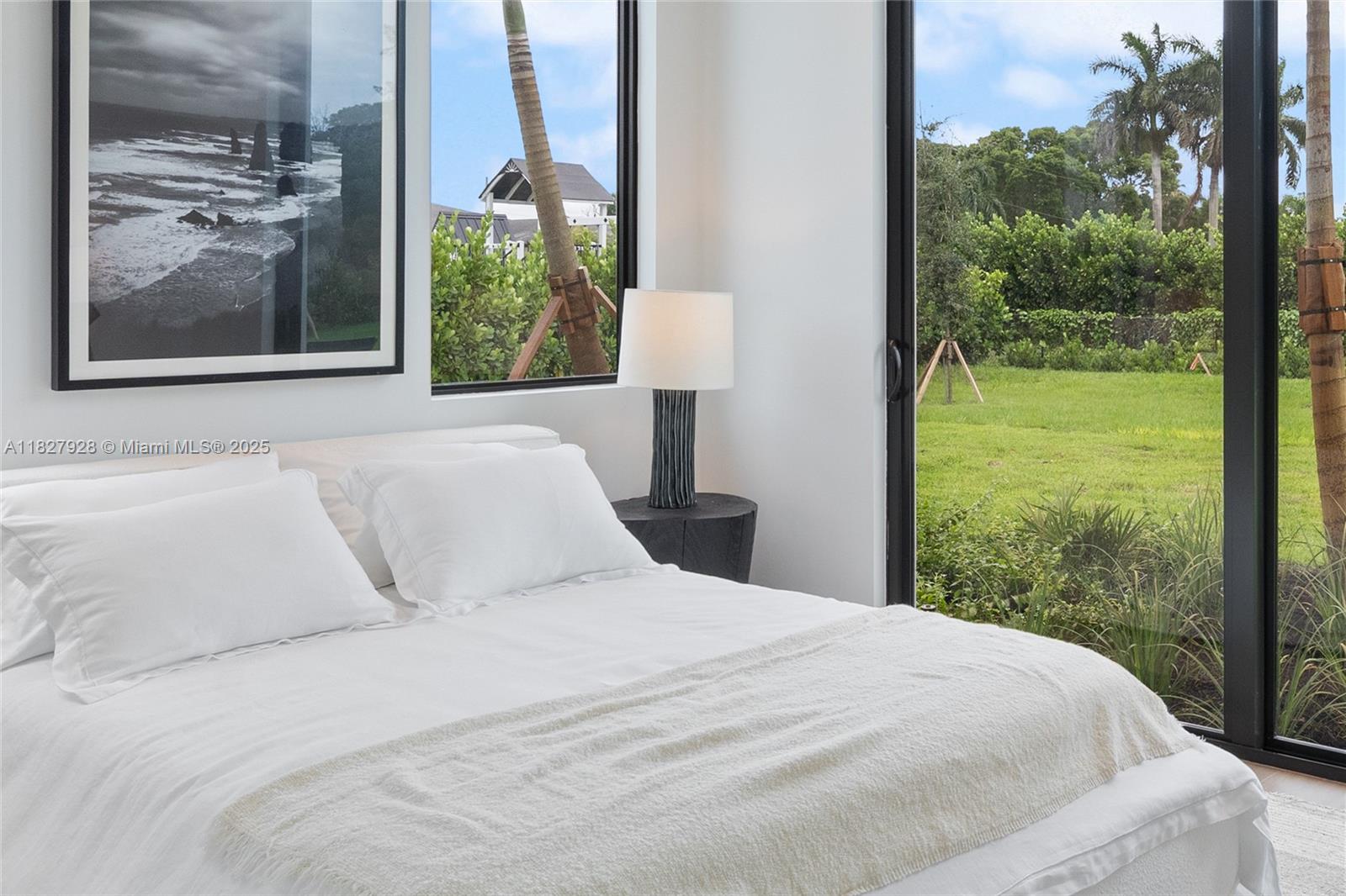 1520 Southwest 149th Terrace Fort Lauderdale, FL 33325 - Photo 46 of 80 a large white bed sitting in a bedroom next to a window