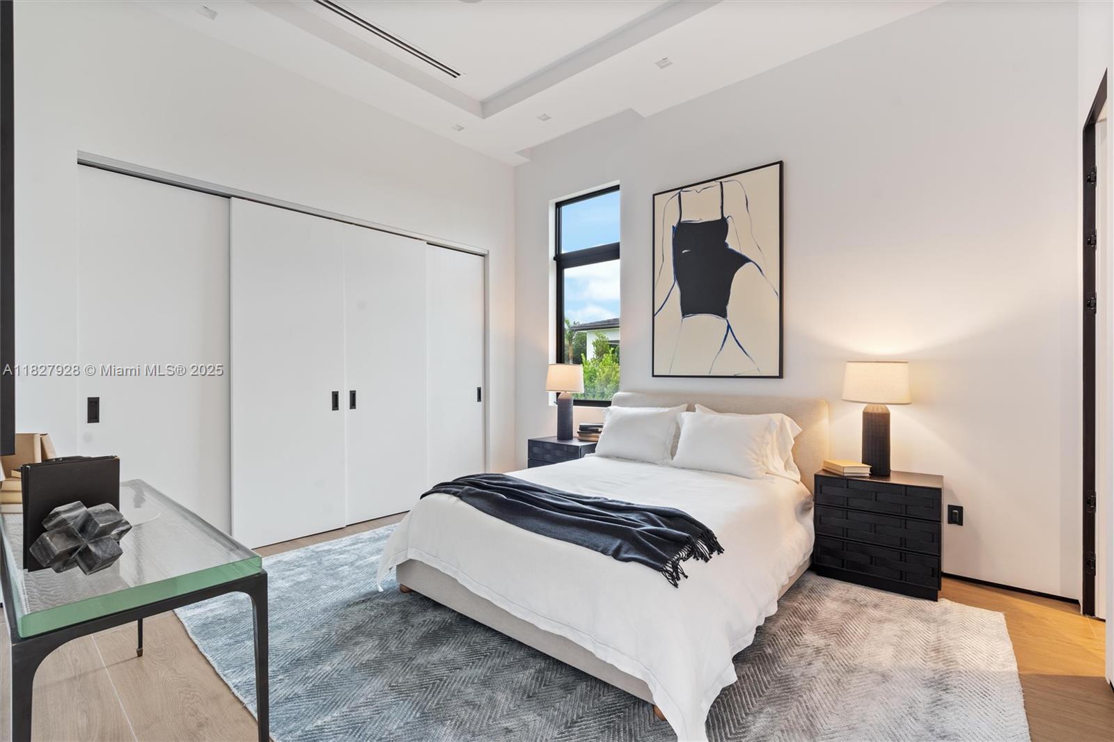 1520 Southwest 149th Terrace Fort Lauderdale, FL 33325 - Photo 49 of 80 a bedroom with a bed and a dresser with mirror