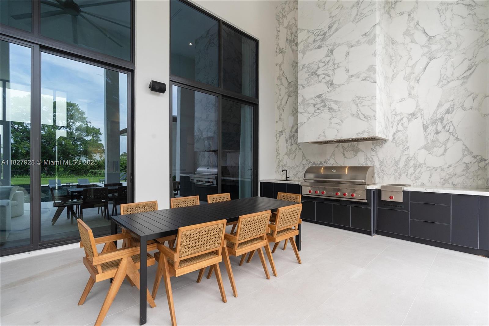 1520 Southwest 149th Terrace Fort Lauderdale, FL 33325 - Photo 67 of 80 a dining room with furniture and large windows