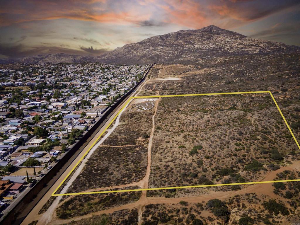 an aerial view of residential houses with yard