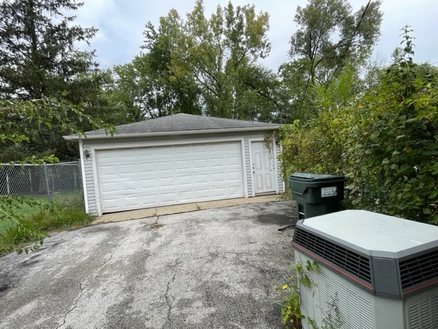 3402 Roesner Drive Markham, IL 60428 - Photo 4 of 5 a backyard of a house with yard and garage