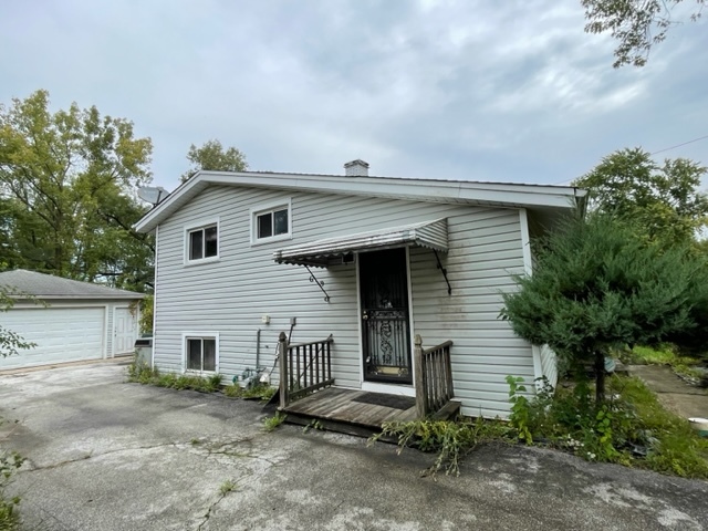 3402 Roesner Drive Markham, IL 60428 - Photo 5 of 5 a front view of a house with a garage