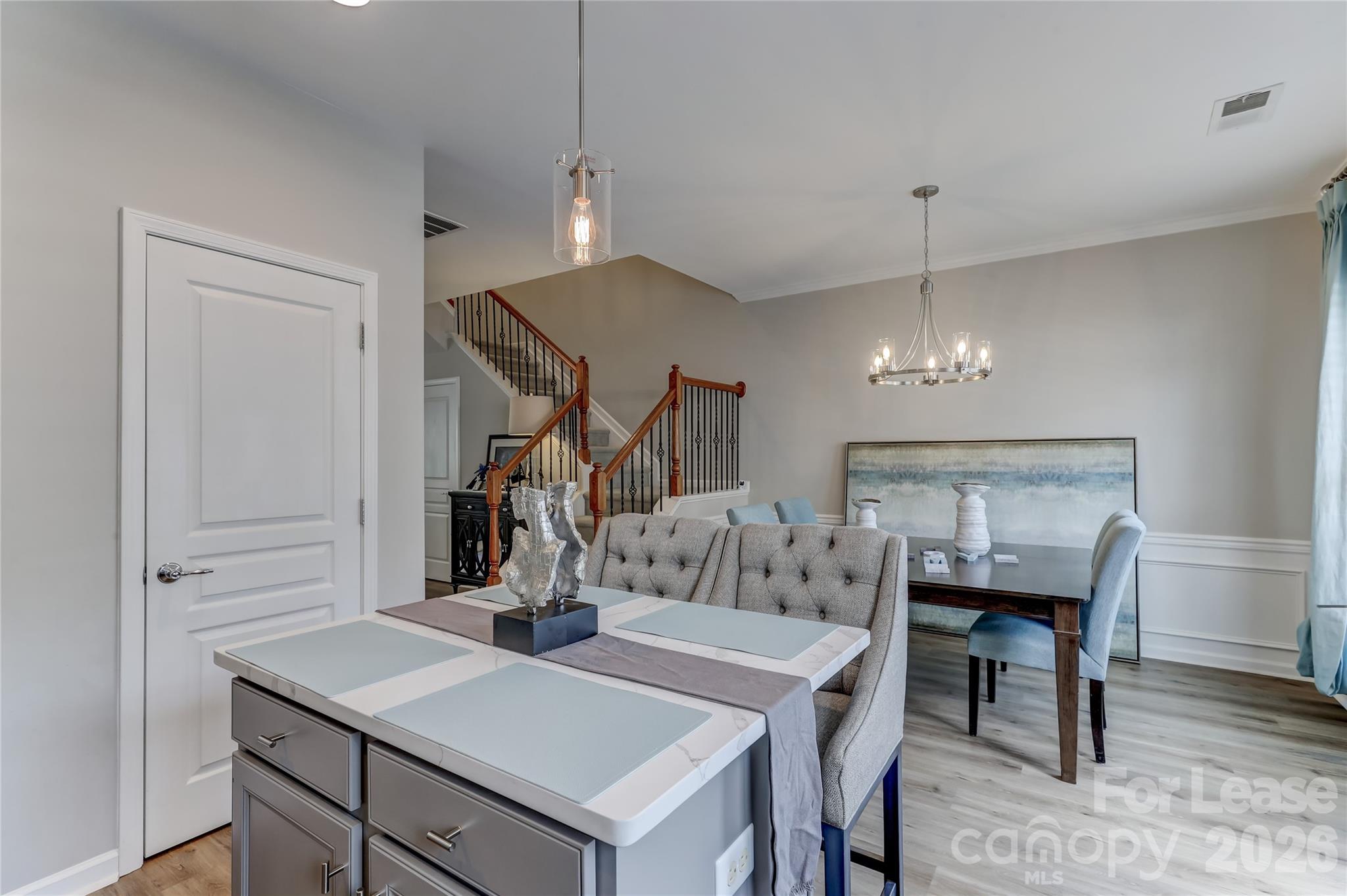 905 Lyndley Drive Fort Mill, SC 29708 - Photo 16 of 42 a view of a dining room with furniture and wooden floor