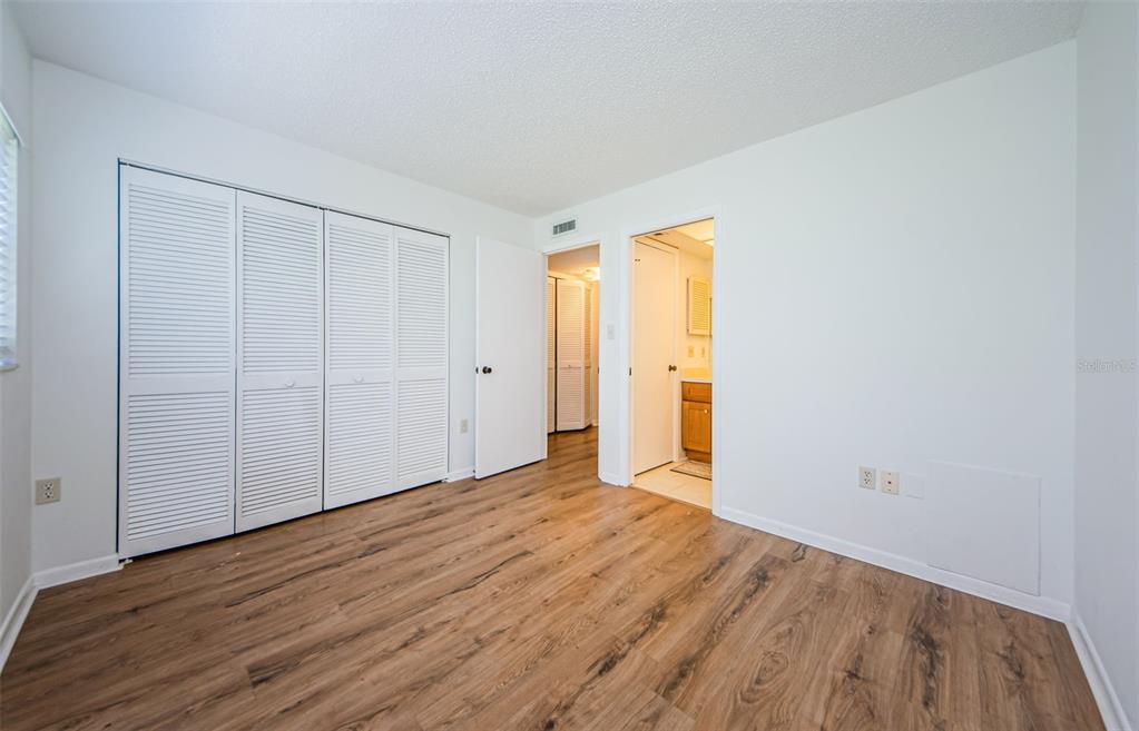 2650 Countryside Boulevard, Unit F110 Clearwater, FL 33761 - Photo 16 of 26 a view of an empty room with wooden floor