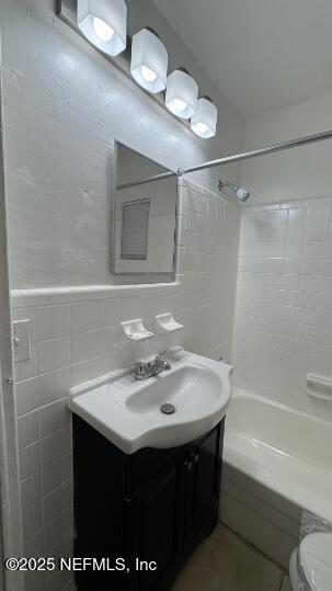 1052 Maynard Street, Unit 1054 Jacksonville, FL 32208 - Photo 3 of 8 a bathroom with a sink a toilet and shower