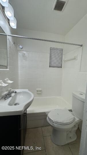 1052 Maynard Street, Unit 1054 Jacksonville, FL 32208 - Photo 4 of 8 a bathroom with a sink a toilet and shower