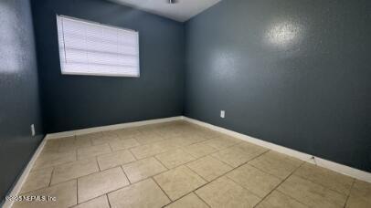 1052 Maynard Street, Unit 1054 Jacksonville, FL 32208 - Photo 6 of 8 a view of empty room with window