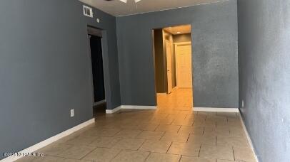 1052 Maynard Street, Unit 1054 Jacksonville, FL 32208 - Photo 7 of 8 a view of an empty room with a gallery