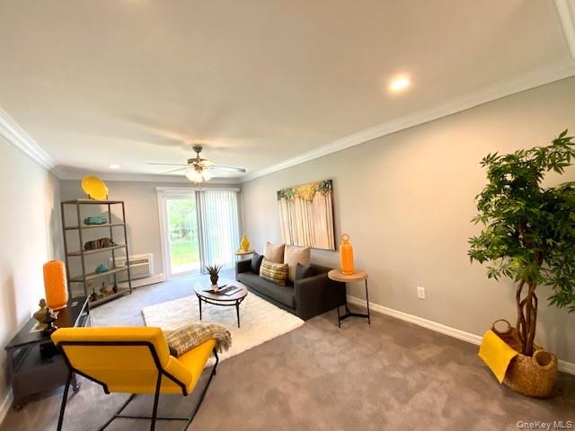 524 Terrace Road, Unit T14524 Bayport, NY 11705 - Photo 8 of 11 a living room with furniture and a potted plant