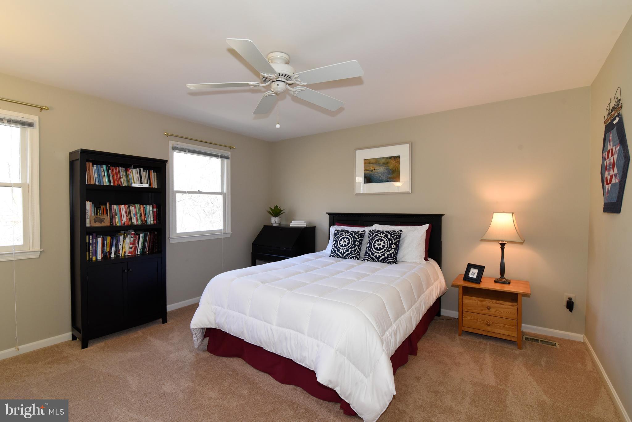 2208 Spinnaker Court Reston, VA 20191 - Photo 33 of 39 a spacious bedroom with a bed and a window
