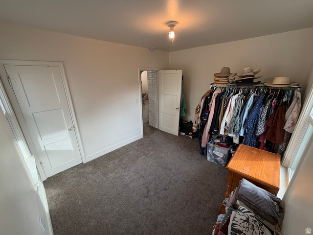 108 West 2nd South Grace, ID 83241 - Photo 13 of 20 Spacious bedroom featuring carpet floors and two windows.