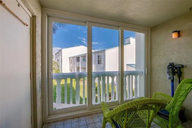a view of balcony with furniture