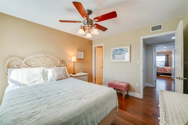 a bathroom with a sink mirror vanity and toilet