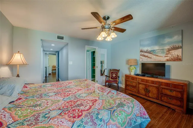 a spacious bathroom with a granite countertop sink a mirror and a toilet