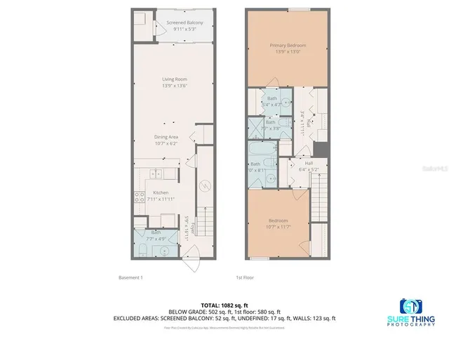 a dining room filled a chandelier and kitchen view