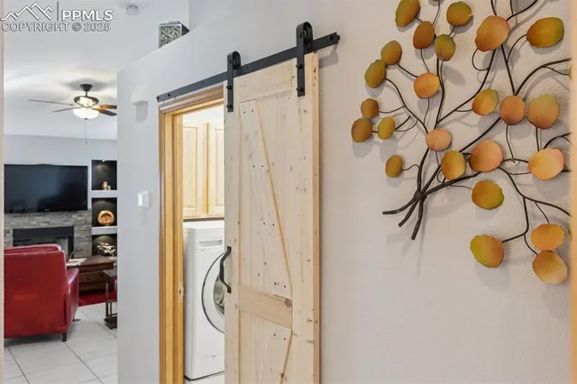 a bathroom with a granite countertop sink a mirror and shower curtain