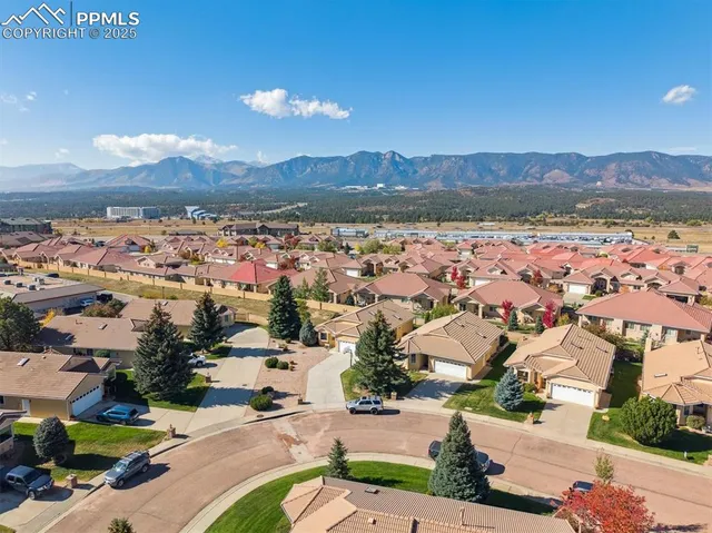 an aerial view of residential houses with outdoor space