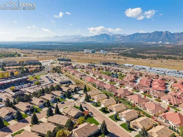an aerial view of residential houses with outdoor space