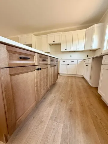 a view of a kitchen with electric appliances