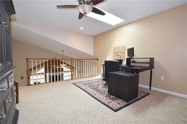 a living room with a piano and a flat screen tv