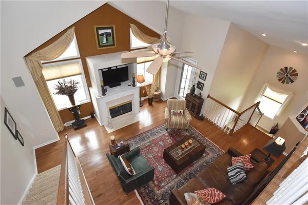 a living room with furniture fireplace and a flat screen tv