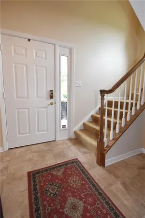 a view of staircase with white walls