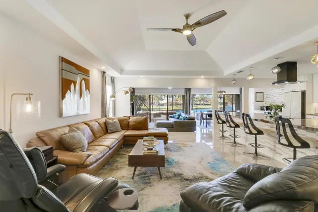 a gym area with gym equipment and a large window