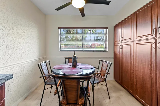 a view of a dining room with furniture window and outside view