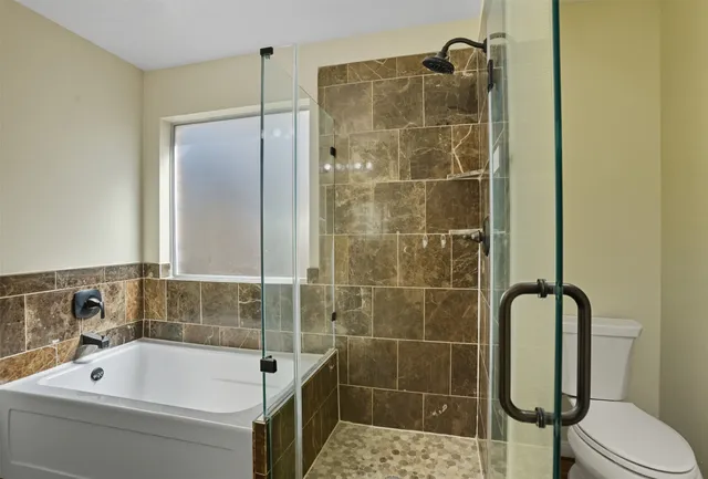 a bathroom with a bathtub and a sink