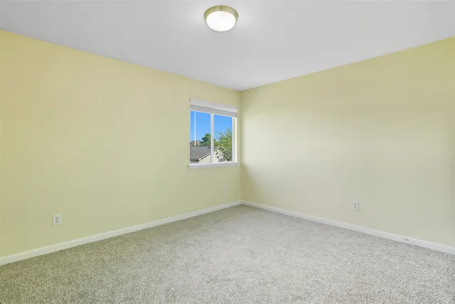 an empty room with a empty space and a window