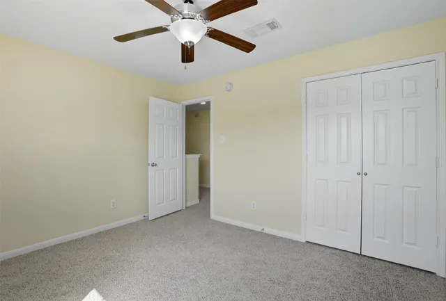 an empty room with closet area
