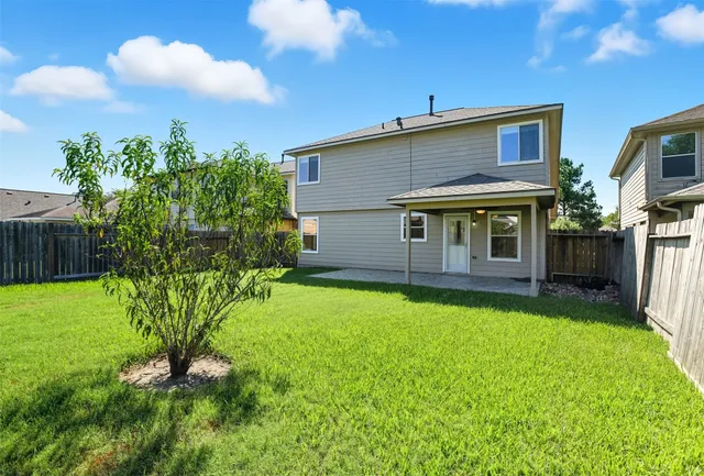 a house view with a garden space