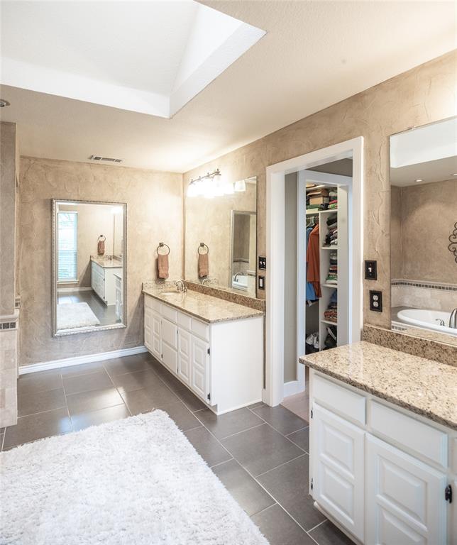 1451 Meandro Ria Lane Fairview, TX 75069 - Photo 27 of 38 a bathroom with a granite countertop sink mirror and bathtub