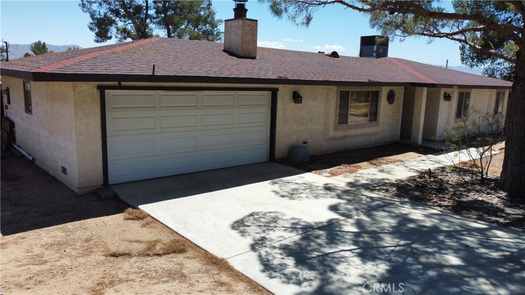 15463 Comanche Road Apple Valley, CA 92307 - Photo 1 of 1 a view of a backyard