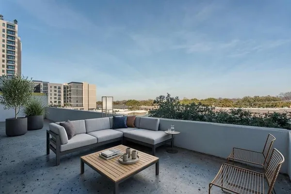 a view of a terrace with couches and a potted plant