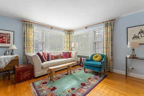 a living room with furniture and a table