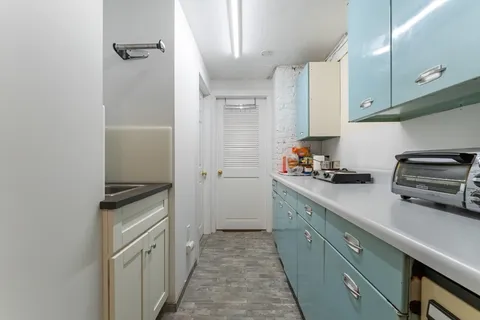 a kitchen with stainless steel appliances a stove and a refrigerator