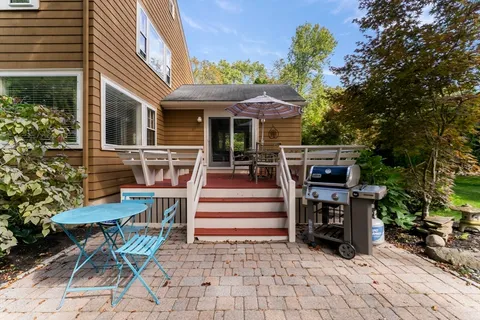 a view of a chairs and table in the patio