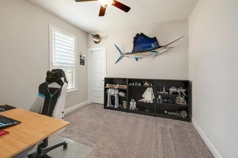 a bedroom with bed and a window