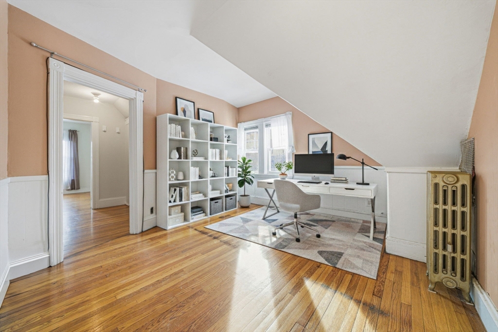 87 Burt Street Boston, MA 02124 - Photo 34 of 40 a living room with furniture and a flat screen tv