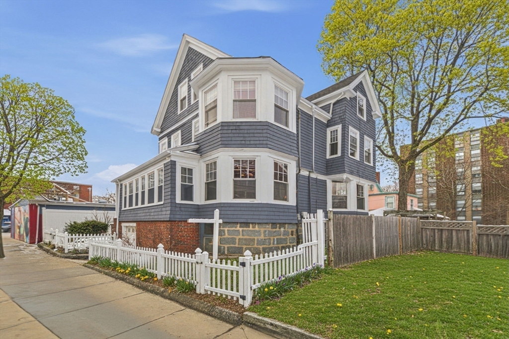 87 Burt Street Boston, MA 02124 - Photo 39 of 40 a front view of a house with a yard