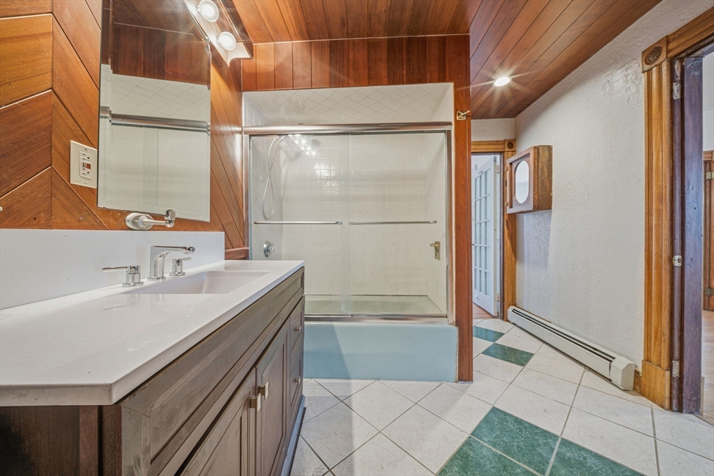 87 Burt Street Boston, MA 02124 - Photo 10 of 40 a bathroom with a sink and a shower