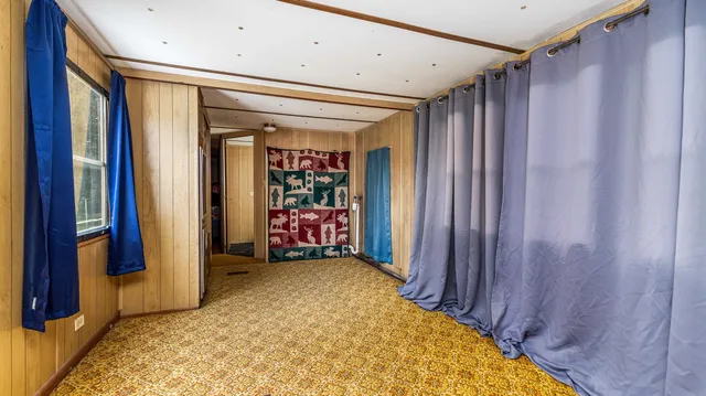 a view of a hallway with a window