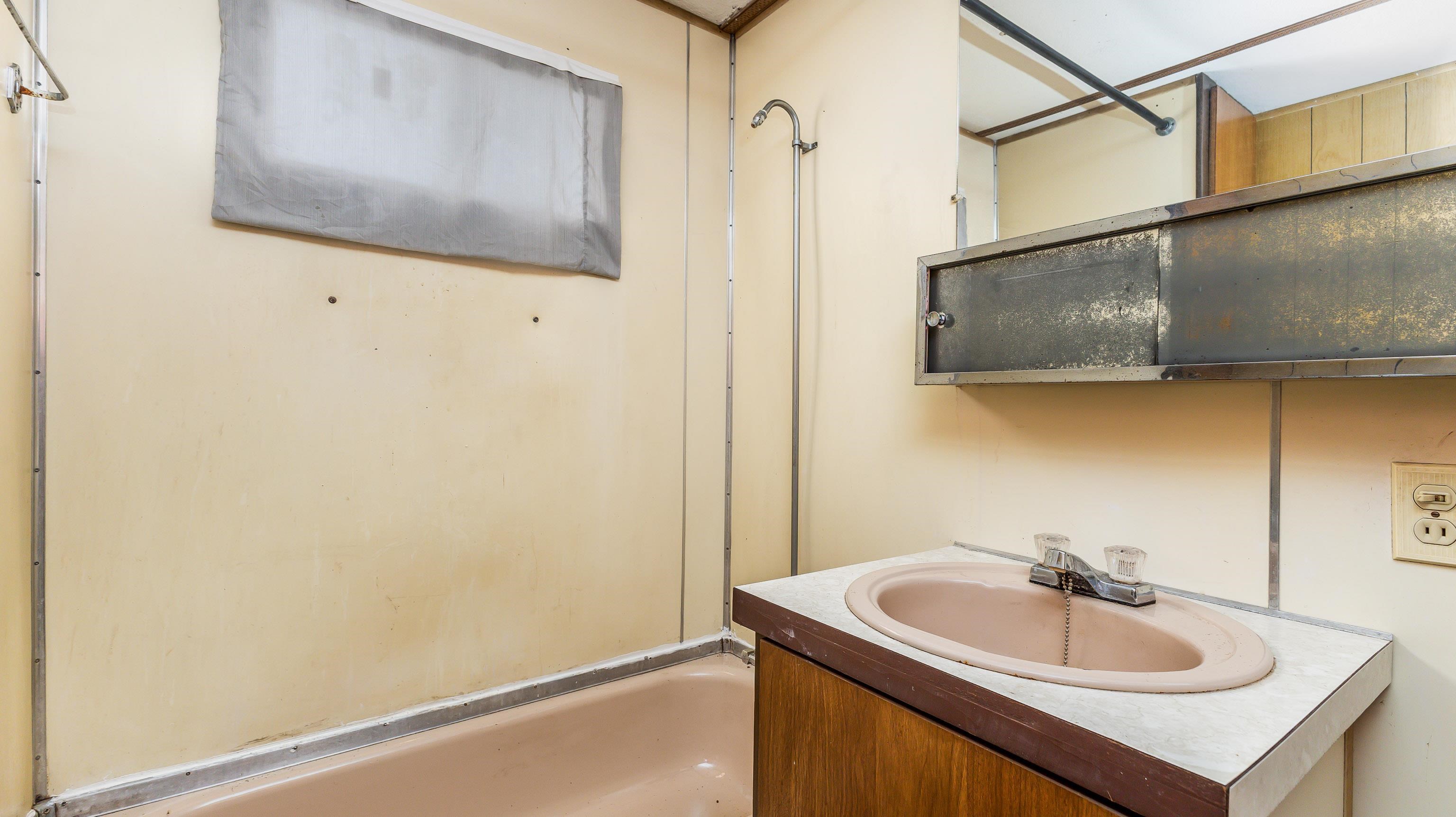 807 West Washington Street Warren, IL 61087 - Photo 21 of 24 a bathroom with a sink and a mirror