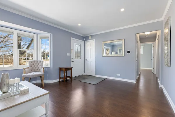 a view of a livingroom with furniture window and wooden floor