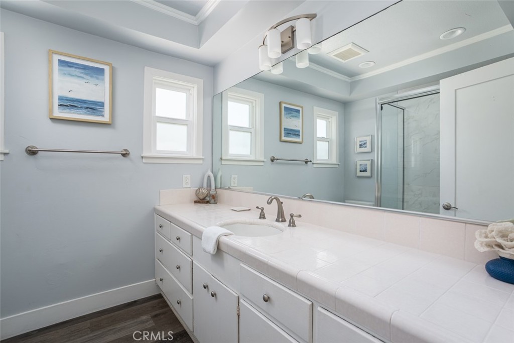 200 East Oceanfront Newport Beach, CA 92661 - Photo 19 of 36 a bathroom with a sink and a mirror