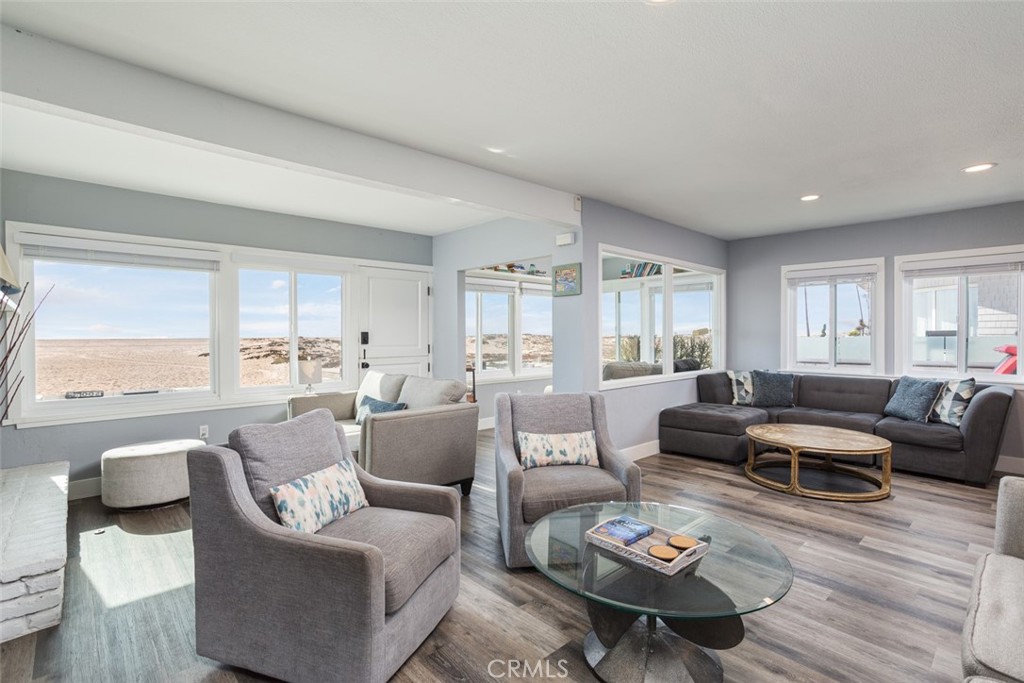 200 East Oceanfront Newport Beach, CA 92661 - Photo 5 of 36 a living room with furniture and a large window