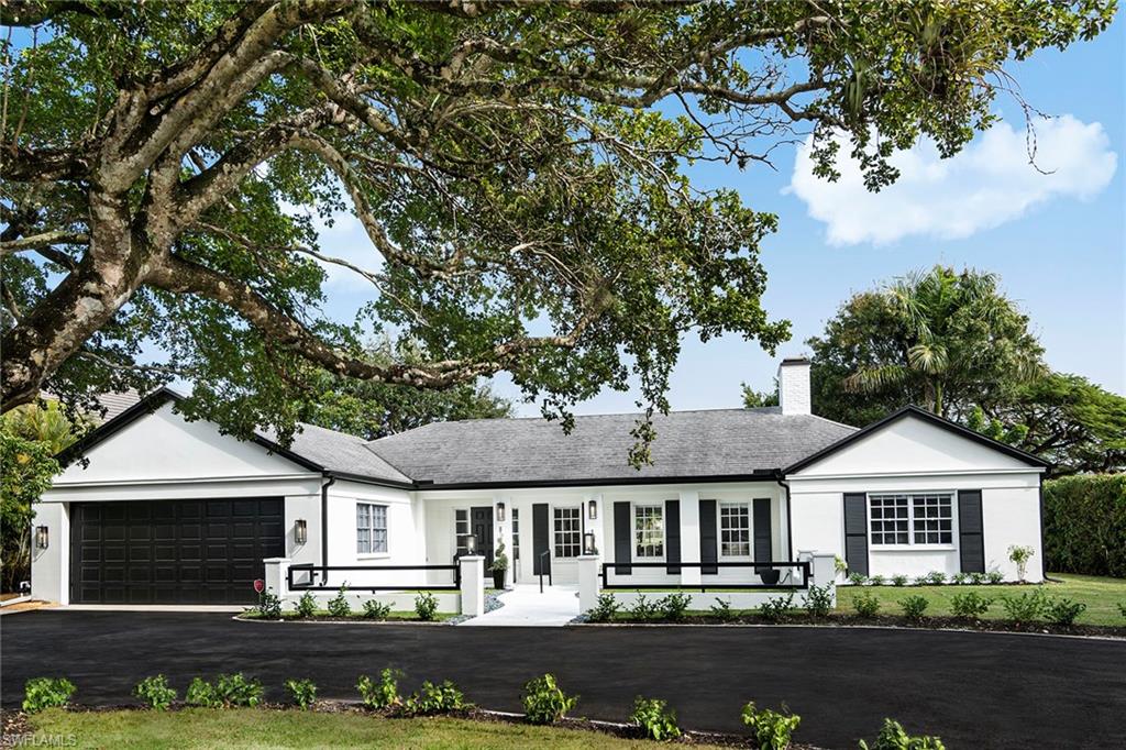 2728 Crayton Road Naples, FL 34103 - Photo 14 of 14 front view of a house with a street