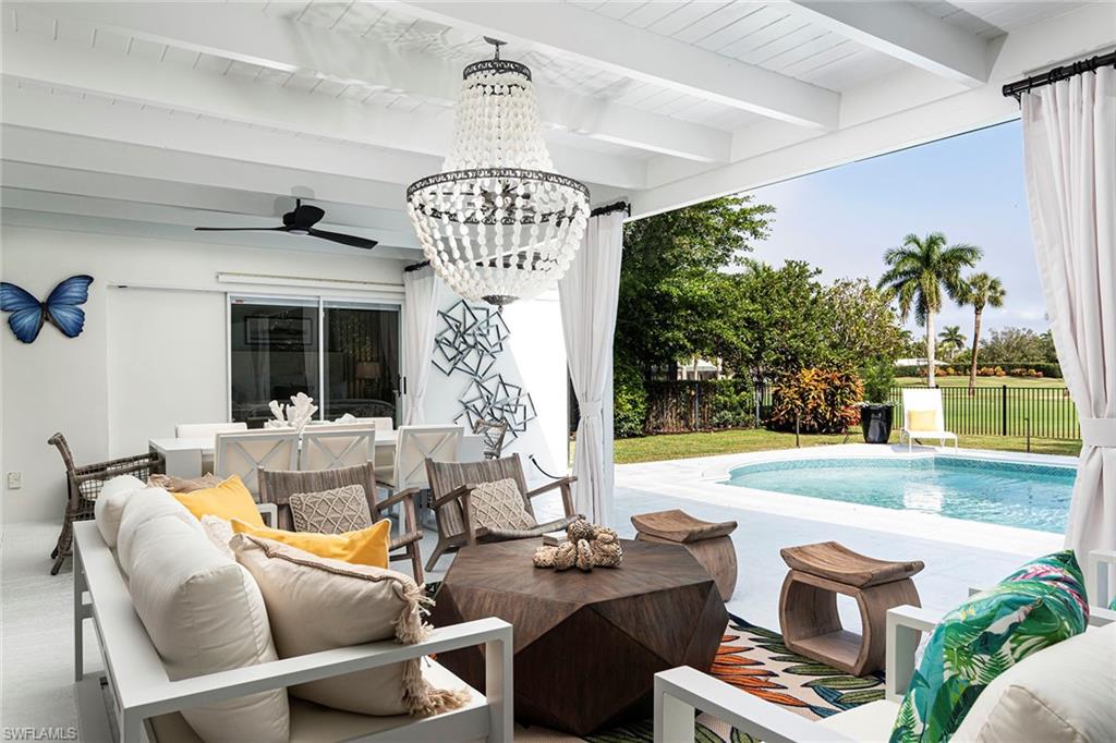 2728 Crayton Road Naples, FL 34103 - Photo 10 of 14 a view of a dining room with furniture window and outside view